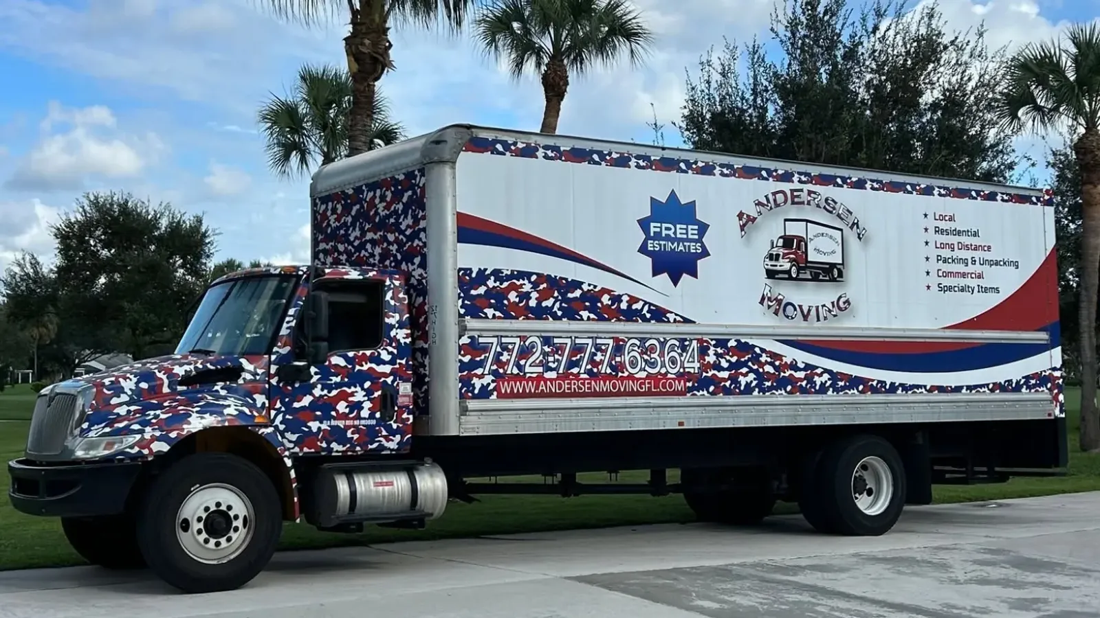 Andersen Moving box truck parked beneath palm trees on a sunny Treasure Coast street.